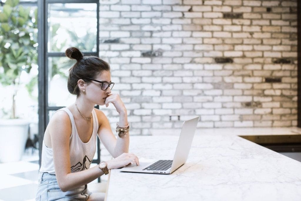 Woman looking at laptop